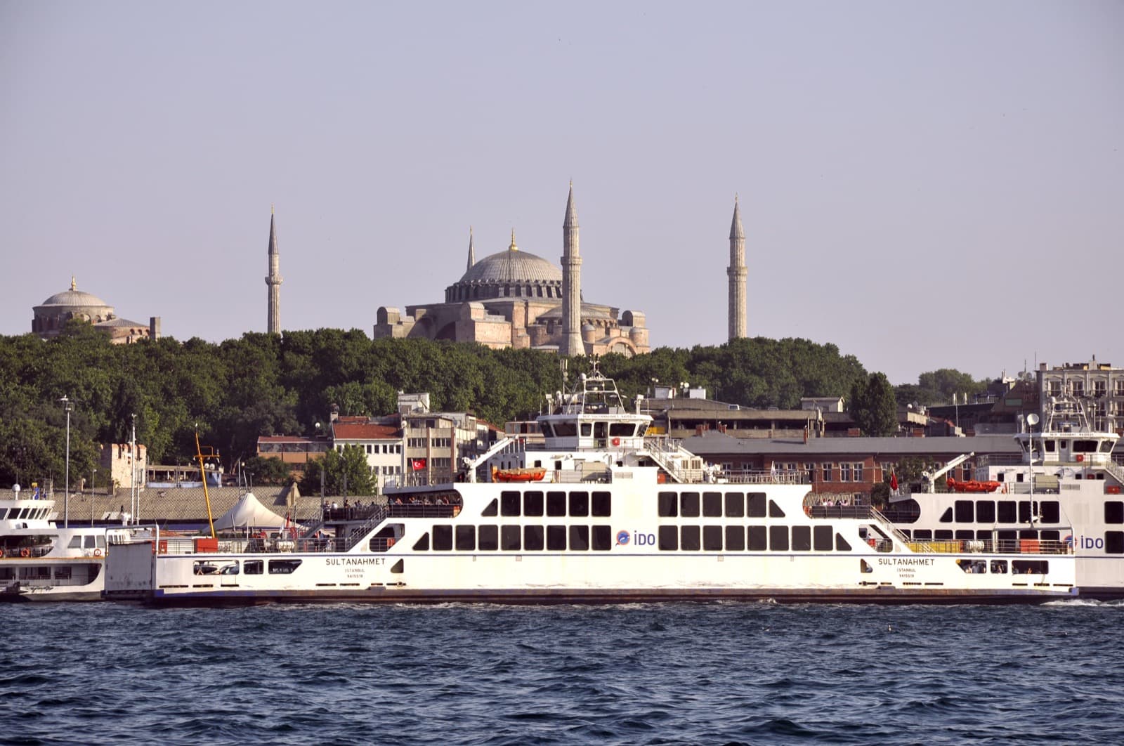 City ferry crossing the Bosphorus with Hagia Sophia and the old city skyline behind